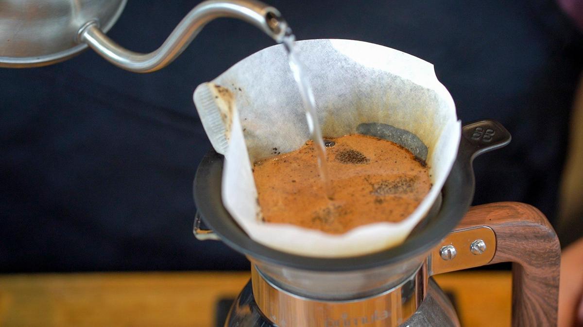 Owner of Brewed, Andrew Cooperrider, makes coffee Wednesday through the pour-over method.