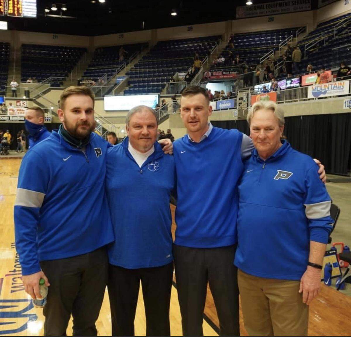 From left to right, Paintsville assistant basketball coach JD VanHoose; Paintsville mayor and ex-basketball coach Bill Mike Runyon; current Paintsville head man Landon Slone; and Tigers assistant coach David VanHoose posed after the Tigers beat archrival Johnson Central in the 15th Region Tournament finals.