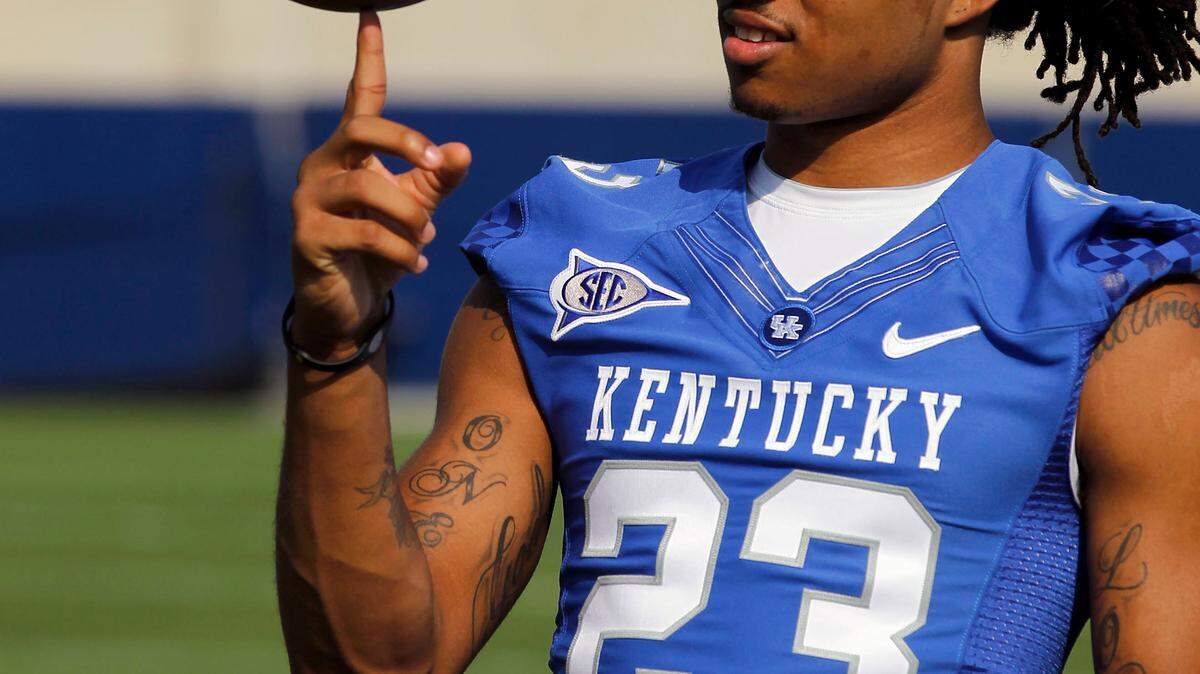 Freshman receiver Daryl Collins, from Gadsden, Ga., spun a ball on his finger during the University of Kentucky football media day held at Commonwealth Stadium in Lexington, Ky., Friday, August 5, 2012.