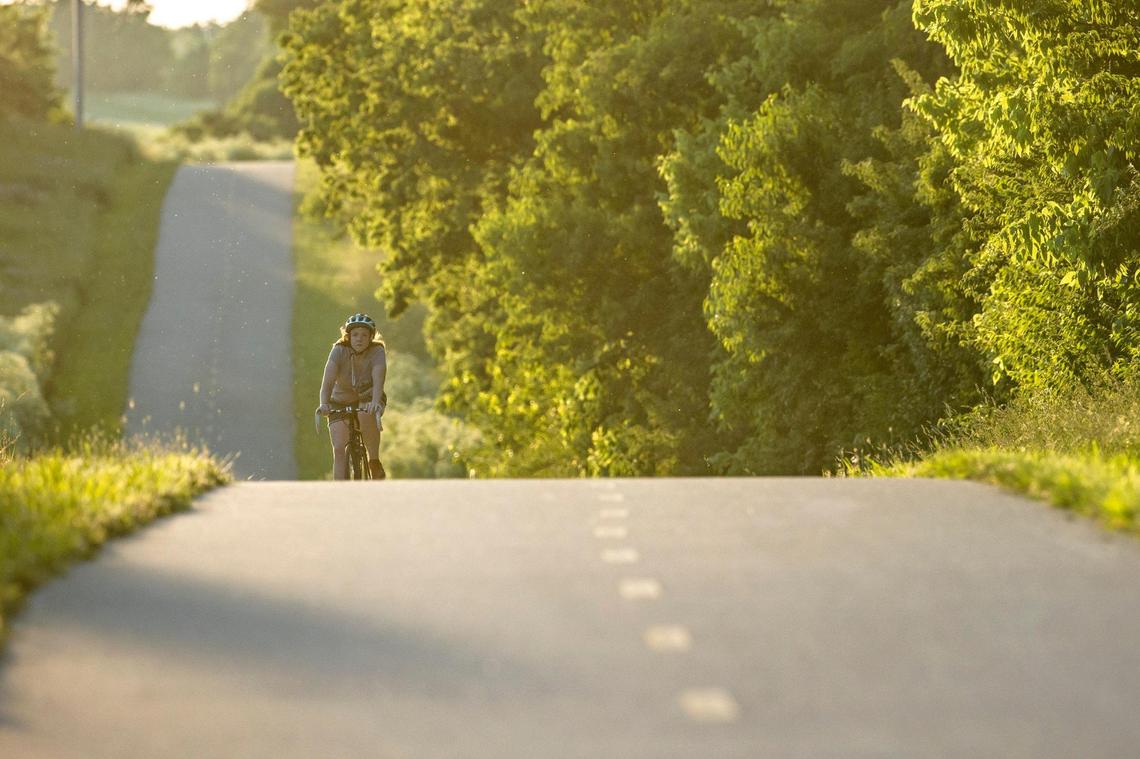 Stella Kapoor of Lexington rides her bicycle along the Legacy Trail near sunset in Lexington, Ky., on Monday, May 30, 2022.