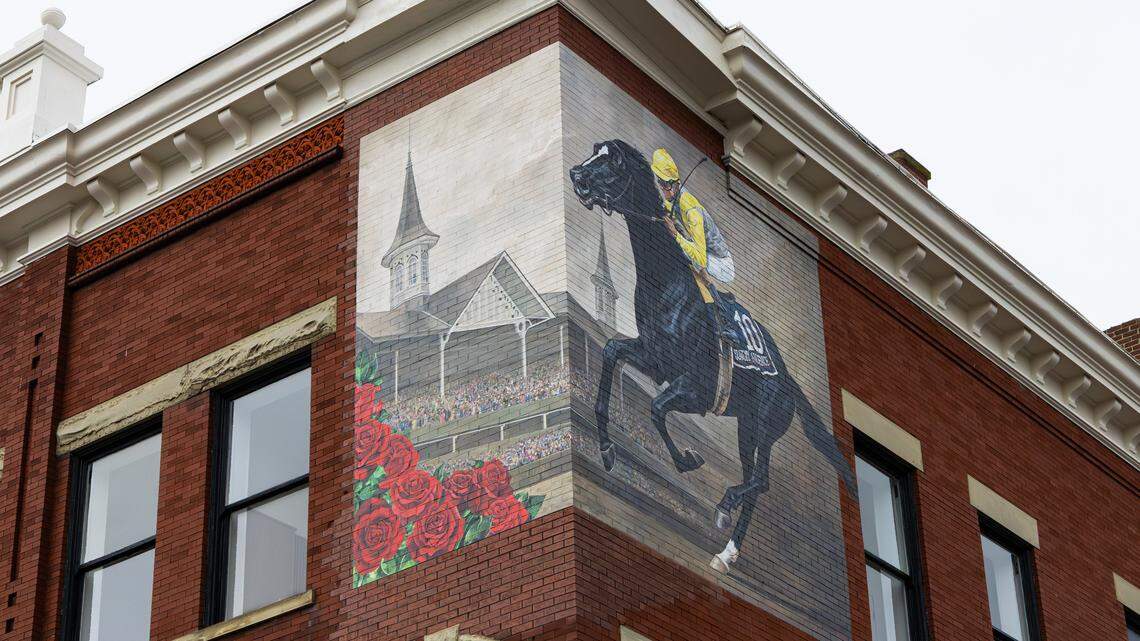 A mural of Sunday Silence, an American Thoroughbred racehorse and winner of the 1989 Kentucky Derby, is painted on the corner of Hotel Thoroughbred in downtown Paris, Ky, on Dec. 4, 2025.
