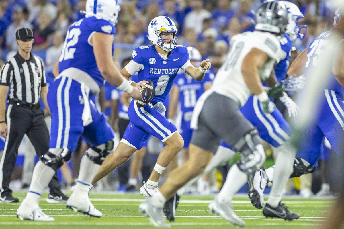 Kentucky Wildcats quarterback Cutter Boley (8) directs his receivers during a game against the Eastern Michigan Eagles at Kroger Field in Lexington, Ky., on Saturday, Sept. 13, 2025.