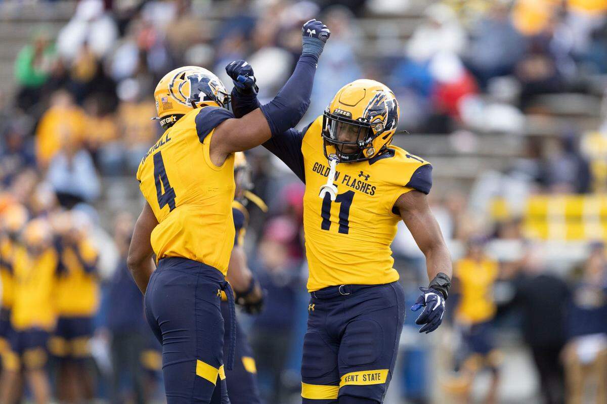 Kent State defensive end Kameron Olds (right) and linebacker Rocco Nicholl celebrate after Olds makes his second sack against Saint Francis (Pa.), Sept. 7, 2024.