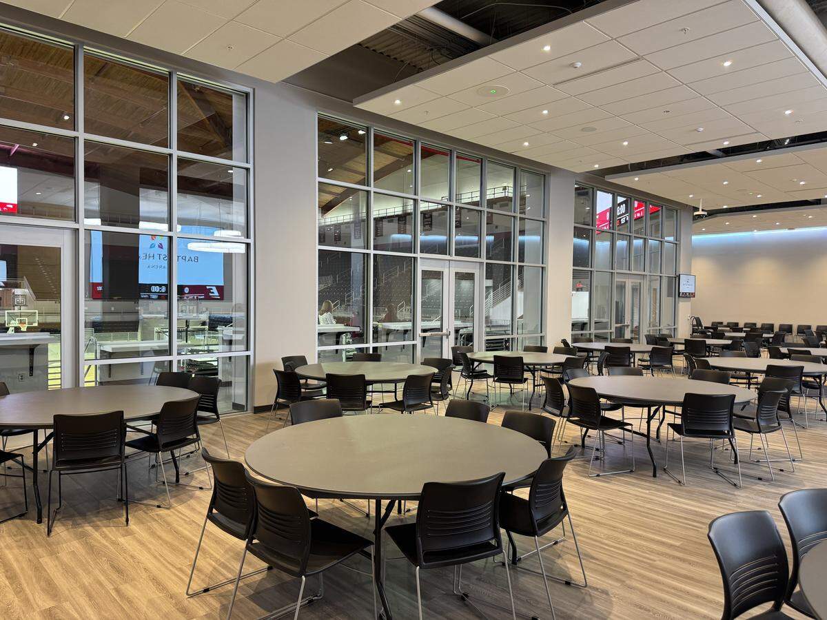 A new seating area at Baptist Health Arena at Alumni Coliseum overlooks one end of the venue’s basketball court. The facility reopened Monday
