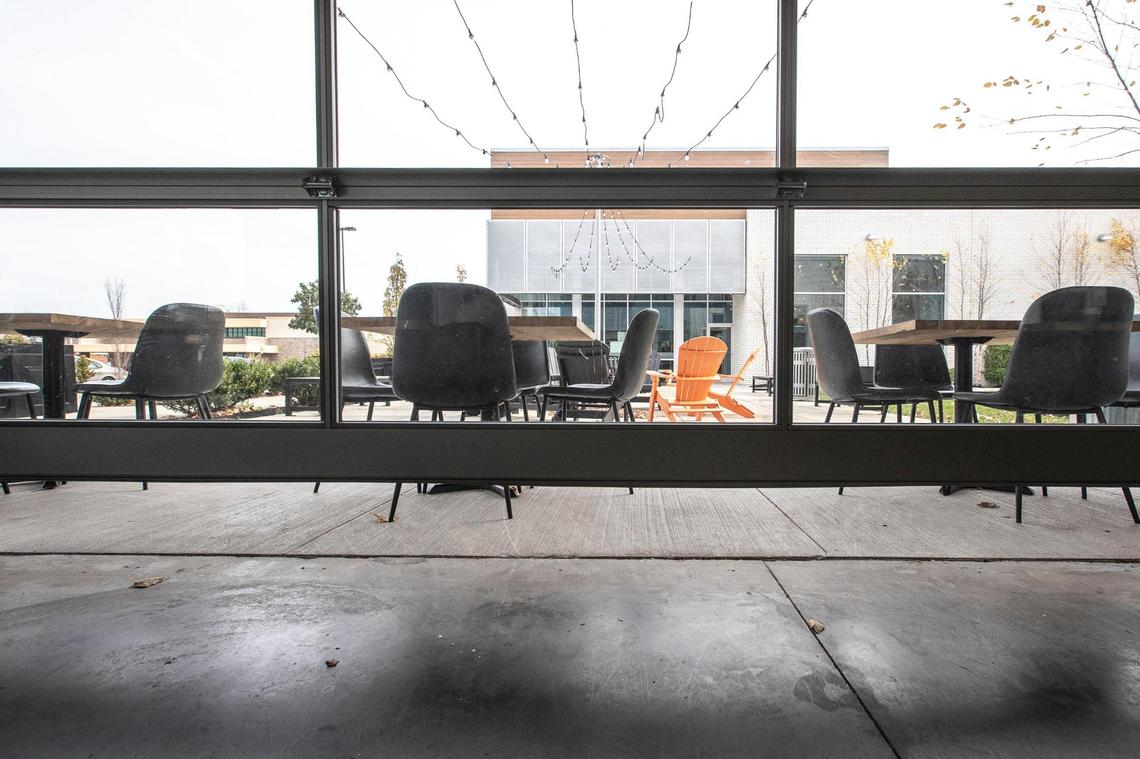 A sign posted on the door of Brewed in Lexington, Ky., said said the garage door in the establishment was open, “which allows it to be a patio, which is considered outside, so come in.”