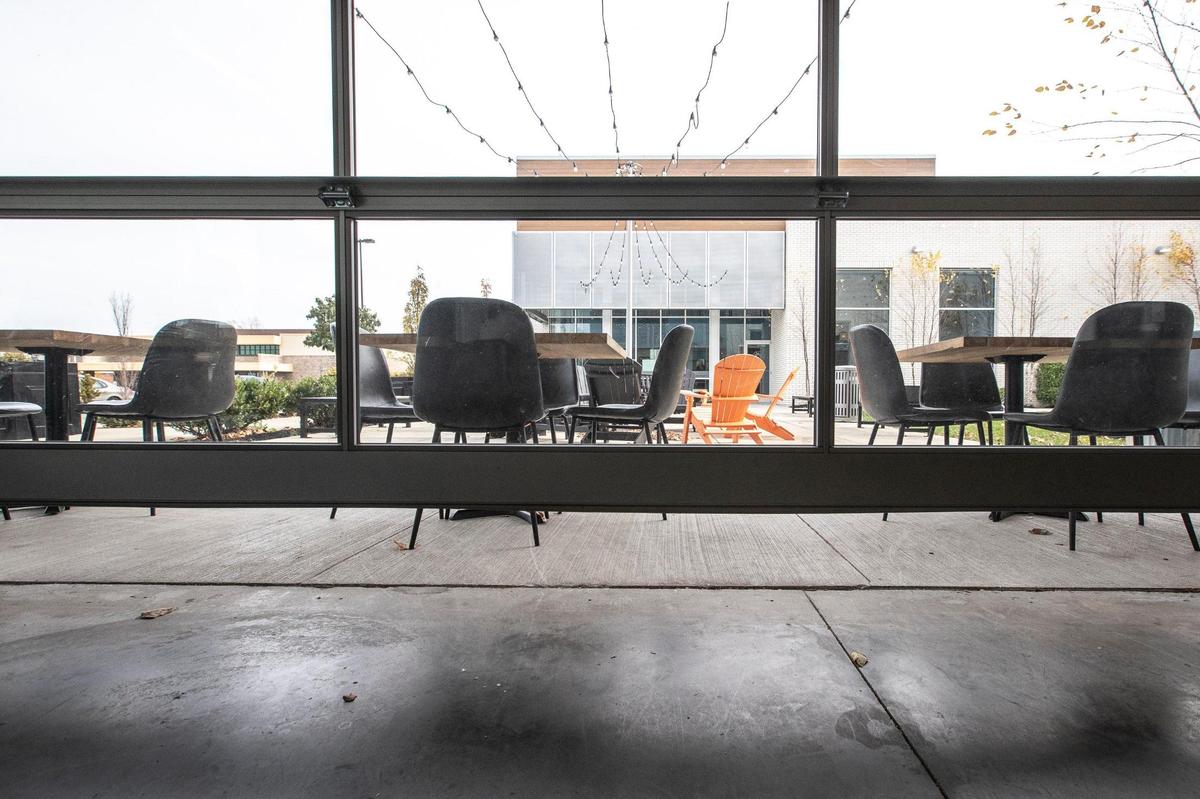 A sign posted on the door of Brewed in Lexington, Ky., said said the garage door in the establishment was open, “which allows it to be a patio, which is considered outside, so come in.”