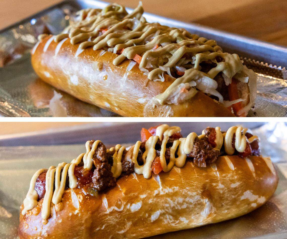 Pretzel dogs and brats are also on the menu at The Wandering Bock Pretzel Pub & Brat Haus. At top, the G.O.A.T. ($9) is made with bratwurst, German sauerkraut and medium mustard. At bottom is the Coney Delk ($10.50), made with 1/4-pound hot dog, Papa’s Cheddar beer cheese, homemade chili and topped with medium mustard and onion. 