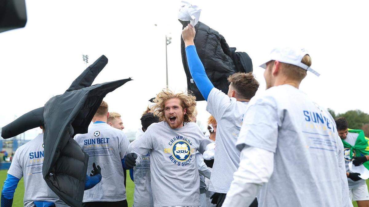 Kentucky players celebrate after winning the Sun Belt Conference Tournament championship and the league’s automatic bid to the NCAA Tournament at UK’s Bell Soccer Complex on Sunday.