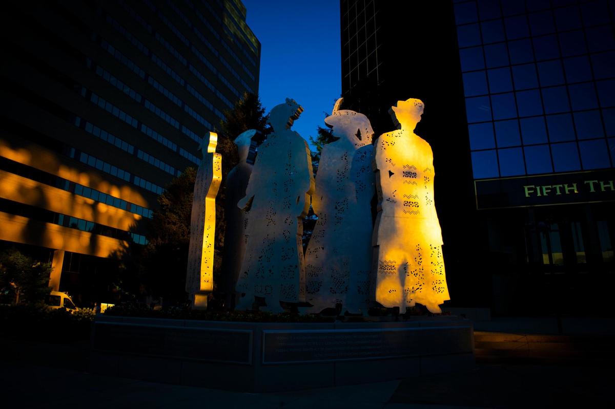 Light hits ‘Stand,’ a 20-foot tall sculpture of five female suffragists by Barbara Grygutis, prior to the celebration of the 100th anniversary of the passage of the 19th Amendment, which gave many women the right to vote, in Lexington, Ky., on Wednesday, August 19, 2020.