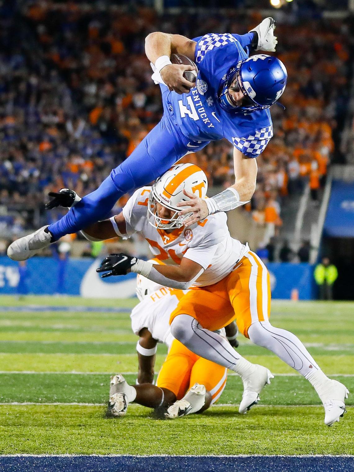 Kentucky Wildcats quarterback Will Levis (7) leaps for a touchdown over Tennessee Volunteers linebacker Aaron Beasley (24) during a game at Kroger Field in Lexington, Ky., Saturday, Nov. 6, 2021.