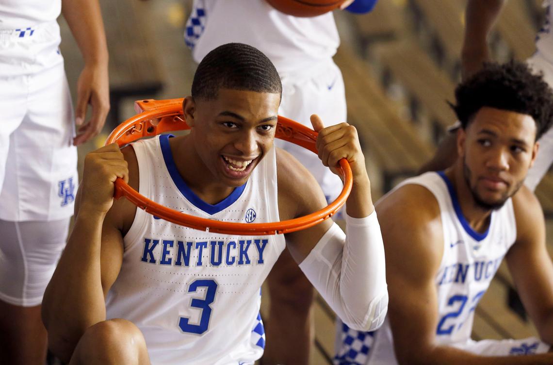 Keldon Johnson posed with a basketball rim during the Kentucky men’s basketball team photo day.