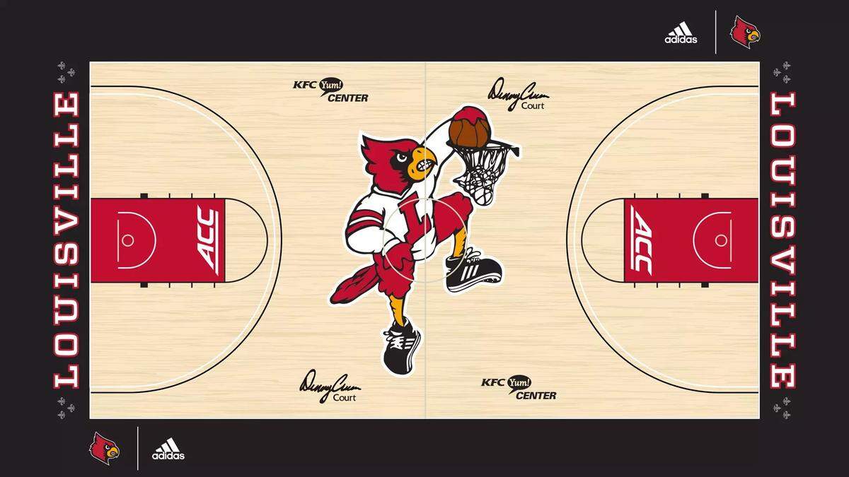 The University of Louisville’s midcourt logo features a retro dunking Cardinal.