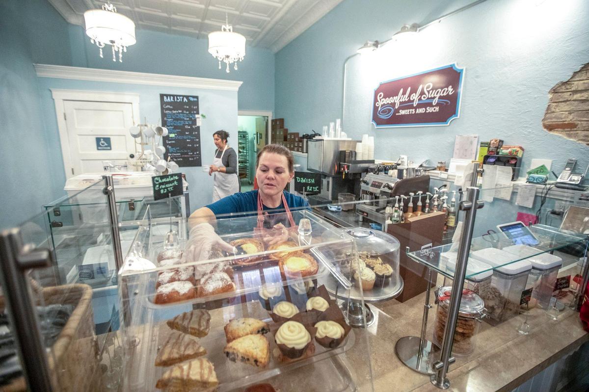 Jessica Hall fills a customer’s order at Spoonful of Sugar, Sweets and Such in Mt. Sterling.