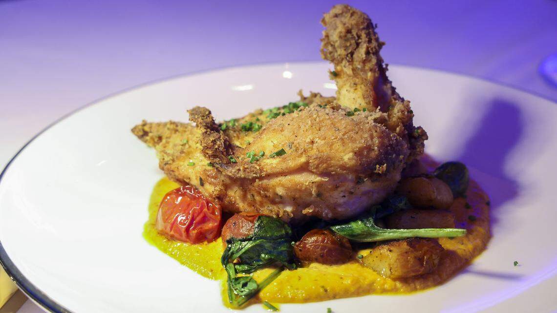 Fried airline chicken breast with ricotta and potato gnocchi, spinach, confit cherry tomato, Castelvetrano olives and sundried tomato cream ($48) from The V, the public restaurant at The Vine, a new downtown Lexington development, photographed Friday, Sept. 5, 2025.