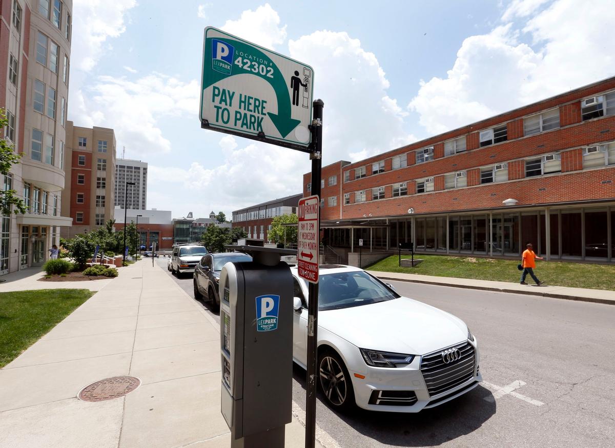 Cars parked on South Martin Luther King Boulevard between Maxwell Street and Avenue of Champions.