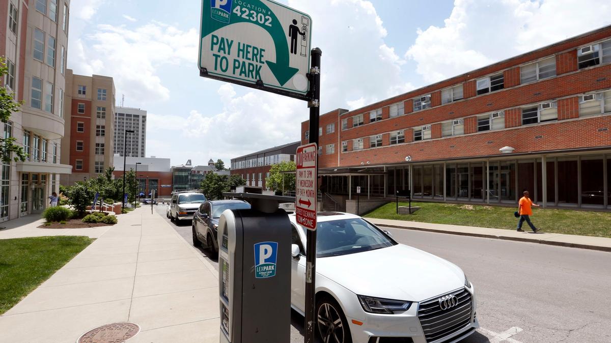 Cars parked on South Martin Luther King Boulevard between Maxwell Street and Avenue of Champions.
