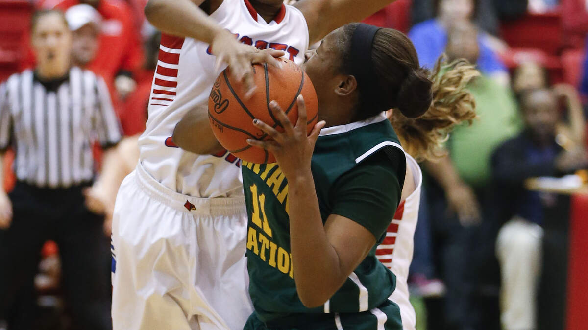 Bryan Station's Serena Sandusky drew a foul on Scott County's Tereka Guyn during the Defenders' victory Thursday. Sandusky had 16 points, four assists and four steals.