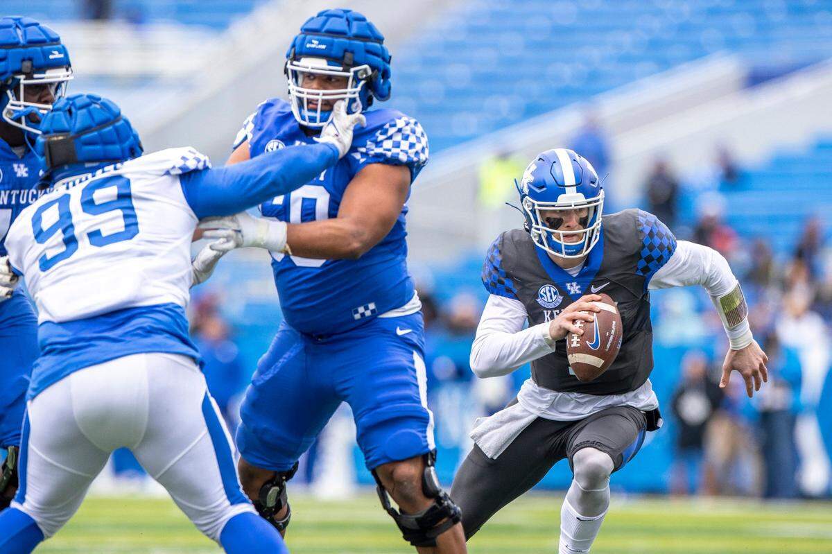 Kentucky quarterback Will Levis (7) looks to run the ball during the Blue-White Spring Game at Kroger Field on Saturday.