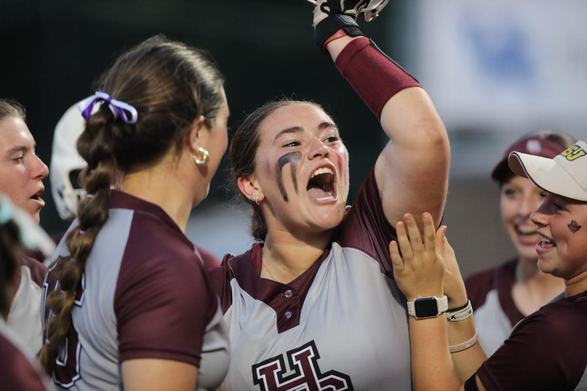 Henderson County’s Mackenzie Burczyk celebrates a home run against South Warren in the state softball semifinals at John Cropp Stadium.