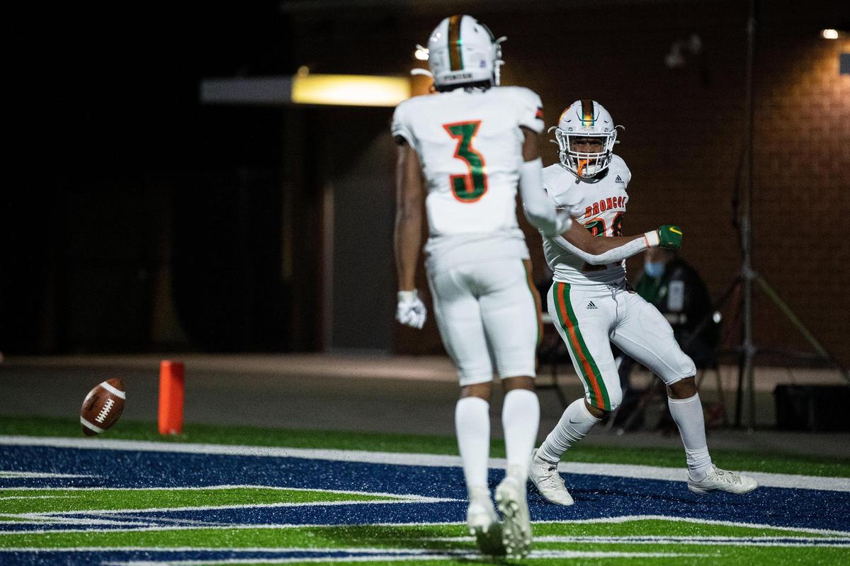 Darius Neal celebrates a touchdown during the Broncos’ win over Scott County in Georgetown. Neal rushed for 168 yards and scored four touchdowns Friday night.