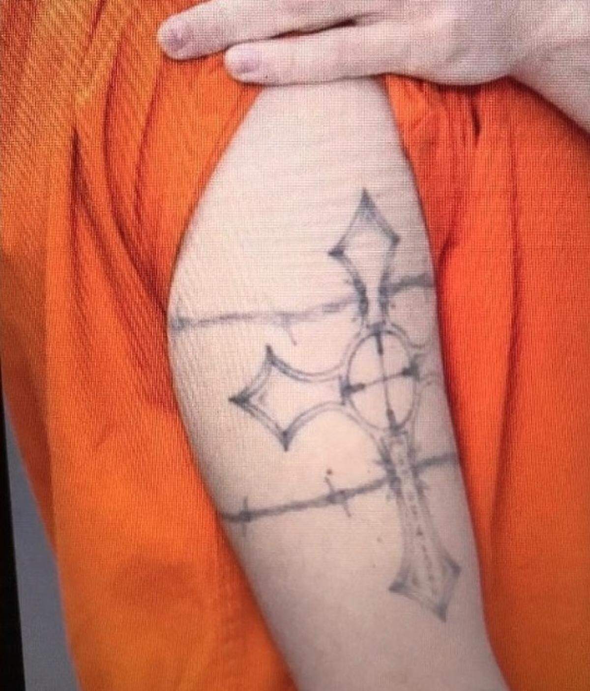 Shawn Christy has this tattoo on his right arm, FBI say.