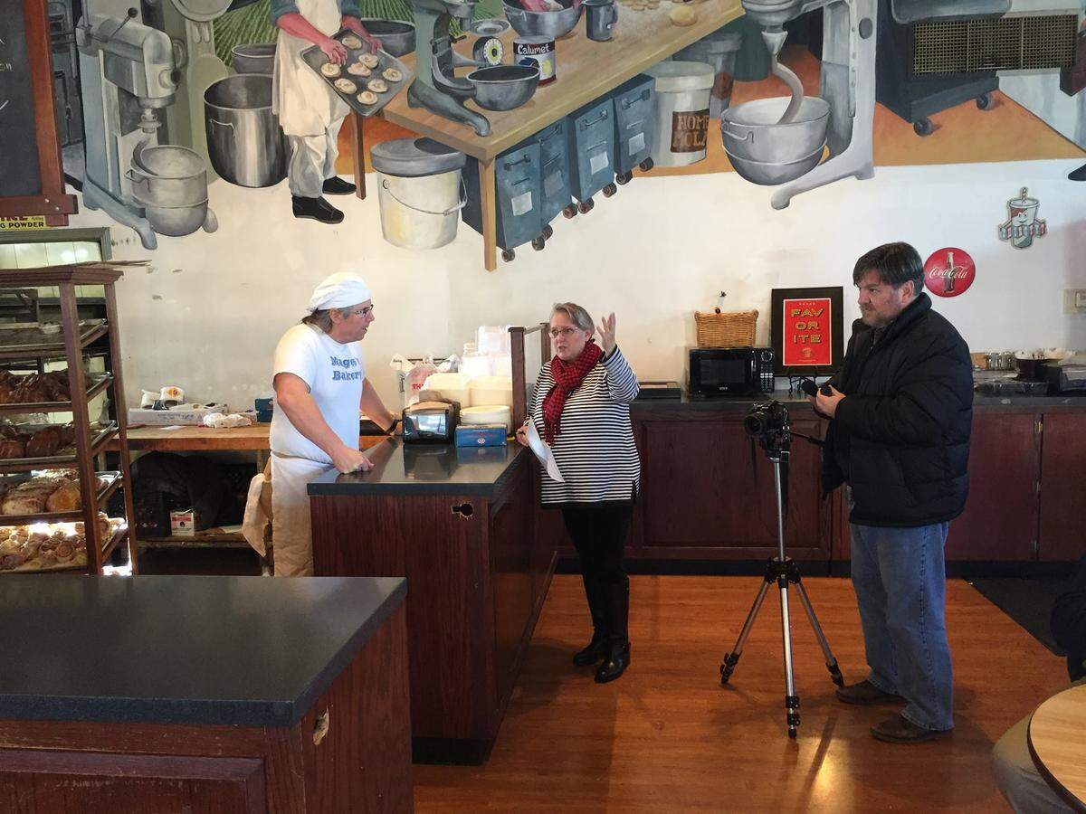 Janet Patton, center, interviews Magee’s Bakery owner Greg Higgins at the now closed popular Lexington bakery.