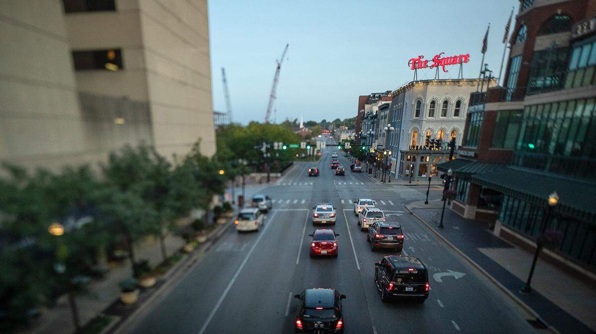 Vehicles drive along West Main Street in downtown Lexington, Ky.