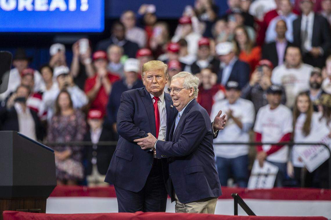 Then-President Donald Trump shakes hands with U.S. Senator Mitch McConnell during a rally at Rupp Arena in Lexington in 2019.