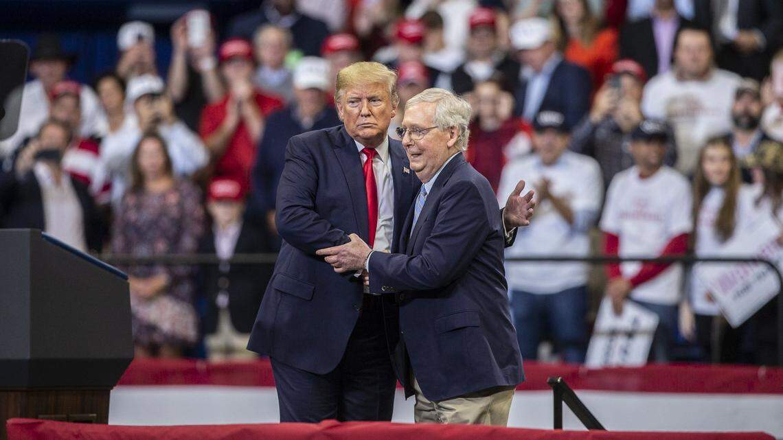 Then-President Donald Trump shakes hands with U.S. Senator Mitch McConnell during a rally at Rupp Arena in Lexington in 2019.
