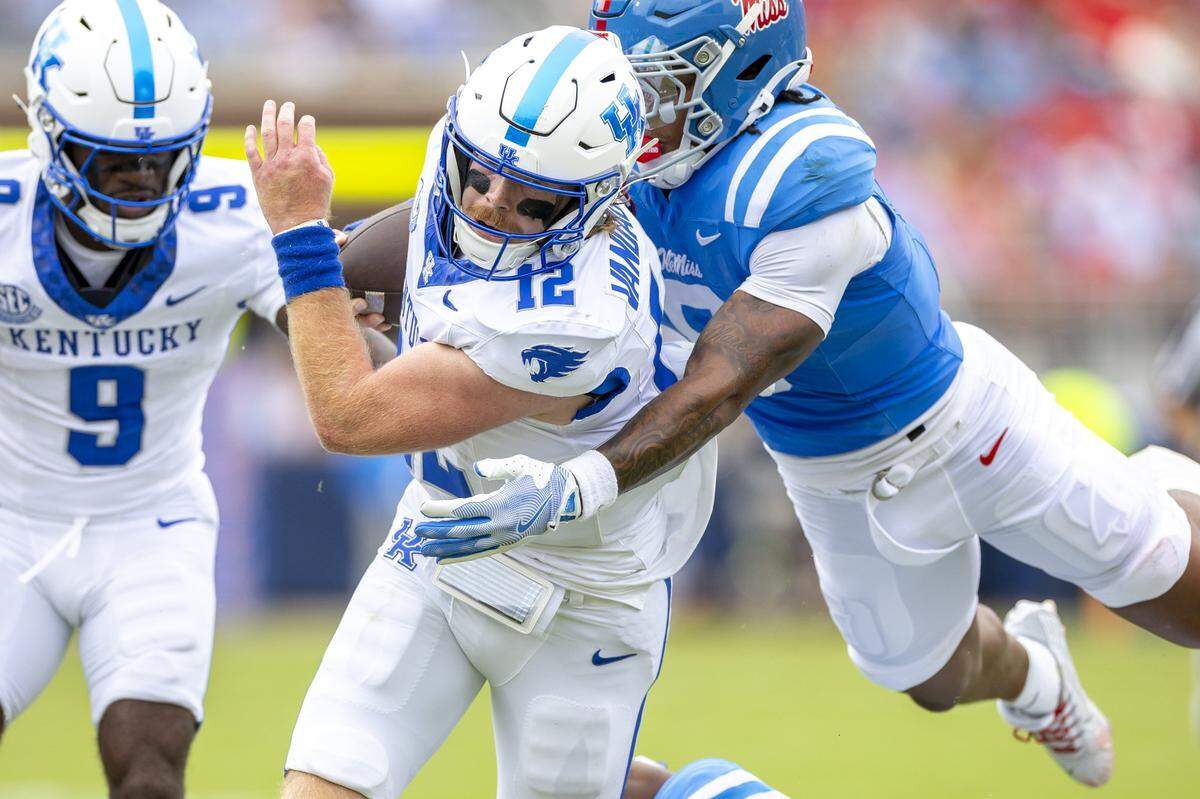 Mississippi cornerback Brandon Turnage (8) tackles Kentucky quarterback Brock Vandagriff (12) during Saturday’s game.