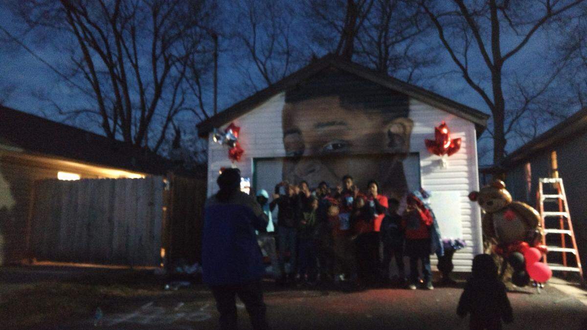 Children posed for a photo in front of a mural of Landon Hayes at a celebration remembering him on his birthday. Landon would have turned 11 on Tuesday.