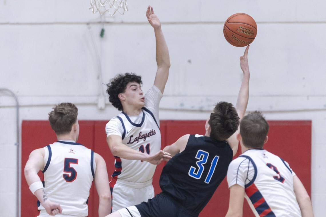 Lafayette's Preston North (11) defends Lexington Christian's Caleb Marshall (31) during a game at Lafayette High School in Lexington, Ky., on Tuesday, Feb. 10, 2026.