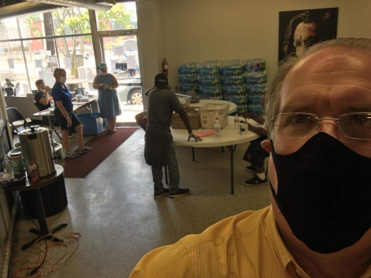 Councilman Bill Farmer helped out Tay Henderson and other Lighthouse Ministries volunteers on Tuesday, July 14