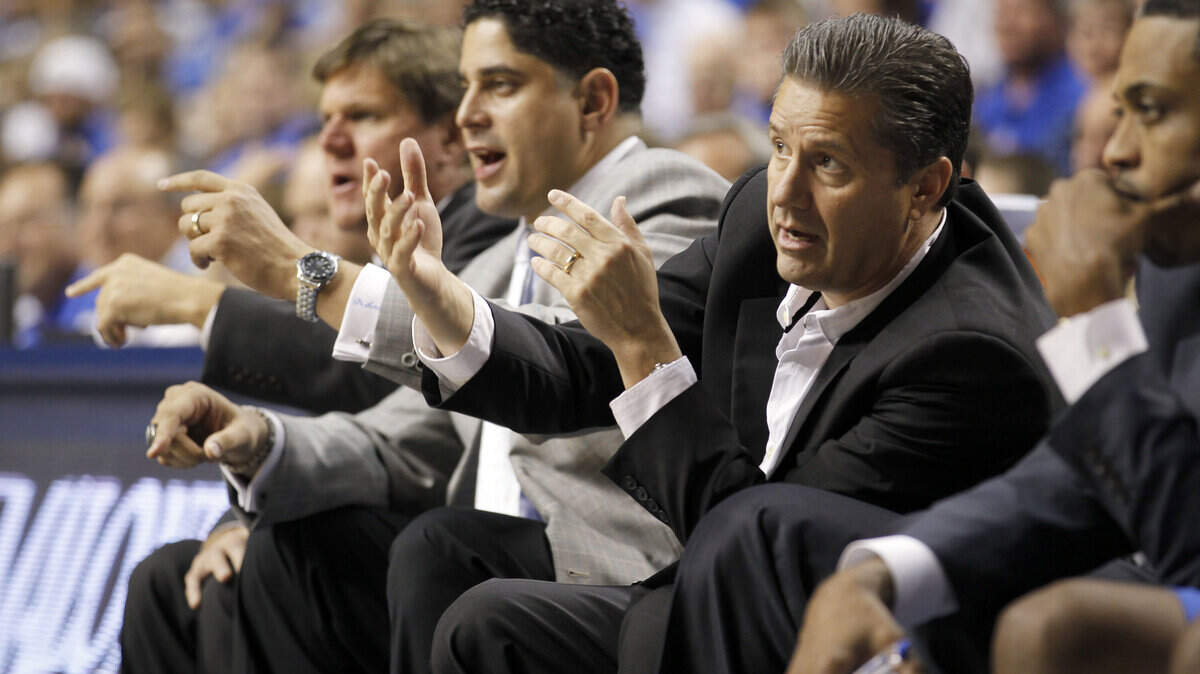 Kentucky Coach John Calipari talked with his assistant coaches during Monday's 125-40 exhibition win over Morehouse College. Calipari and the Cats will start the 2011-12 season for real on Friday night against Marist.  