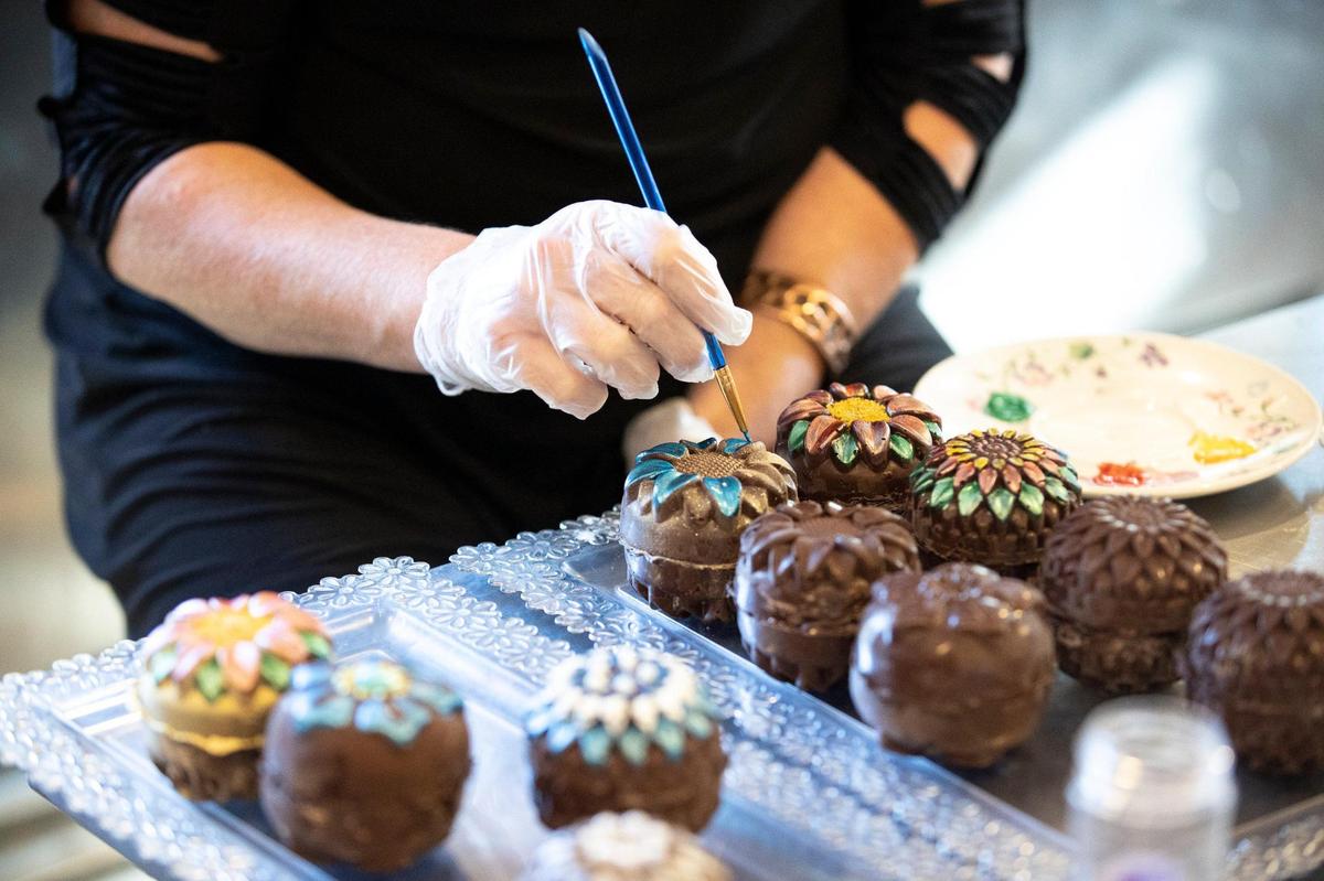 Ruth Ralph decorates hot cocoa bombs Wednesday at Lexington’s Backroads Bakery at 109 W. Sixth St.