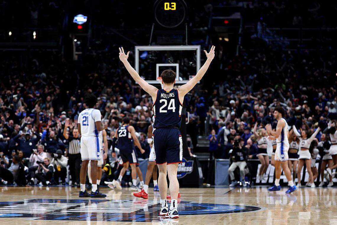 Connecticut freshman guard Braylon Mullins (24) celebrated after his 3-point bomb that ultimately gave UConn a 73-72 upset of Duke in the men’s NCAA Basketball Tourament round of 8 Sunday swished through the net with 0:00.4 of a second remaining in the game.