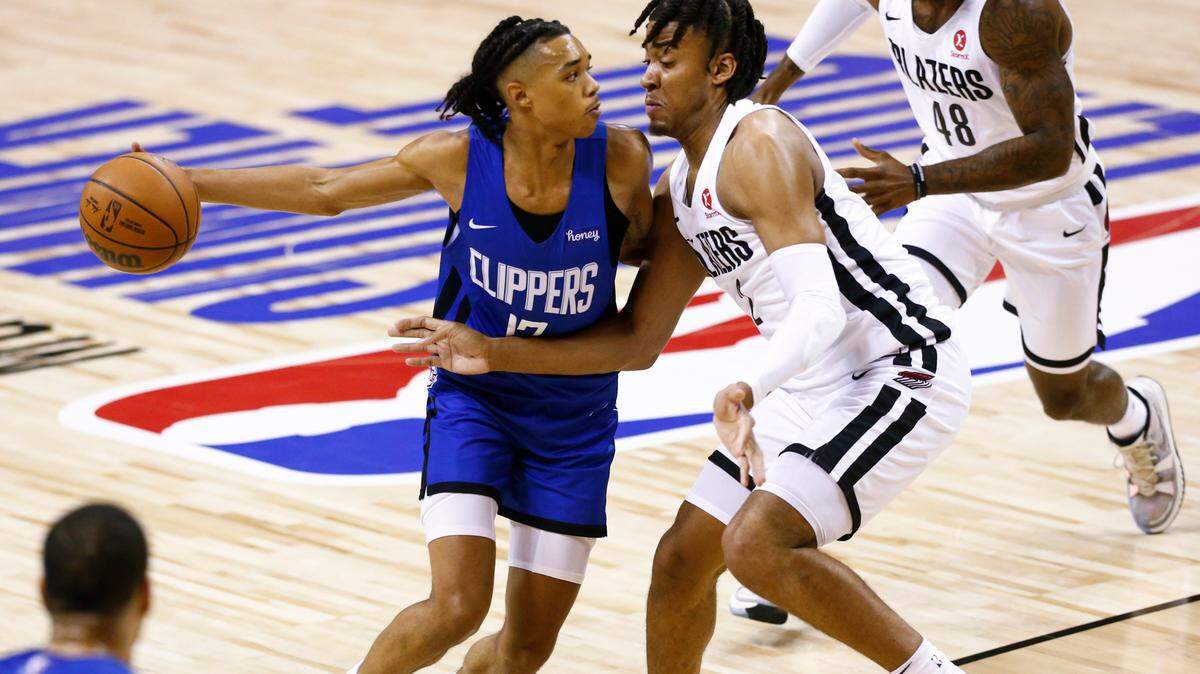 The Clippers’ Brandon Boston Jr., left, drove the ball against the Trail Blazers’ Trendon Watford during the first half of an NBA summer league in Las Vegas on Aug. 10.