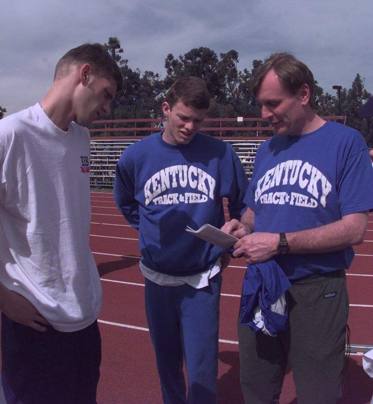 Kentucky Coach Don Weber, right, talked with Wes Freeland, left, and Brad Rogers before a workout at the Stanford University track in Palo Alto, Calif., in 1997.