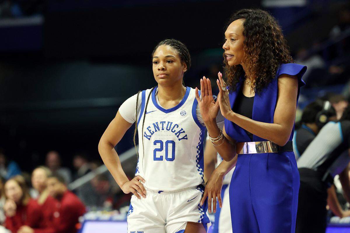 Kentucky head coach Kyra Elzy, right, instructs Amiya Jenkins (20) during Sunday’s loss to top-ranked South Carolina in Rupp Arena. Sunday’s loss ended UK’s two-game winning streak. The Wildcats have two regular season games remaining before the SEC Tournament.