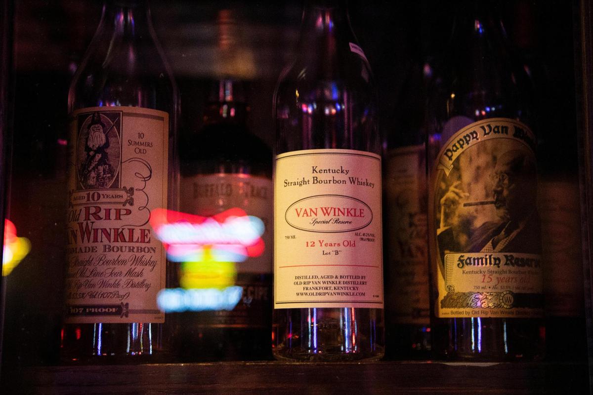 Bottles of select bourbon sit in a display case at Pat’s Snack Bar in Manchester, Ky., Friday, April 15, 2022. Pat’s Snack Bar boasts a large collection of bourbons.