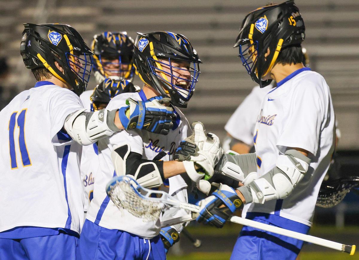Henry Clay’s Cooper Connor (center) was congratulated by his teammates after a goal against Sayre at Henry Clay High School on Wednesday.