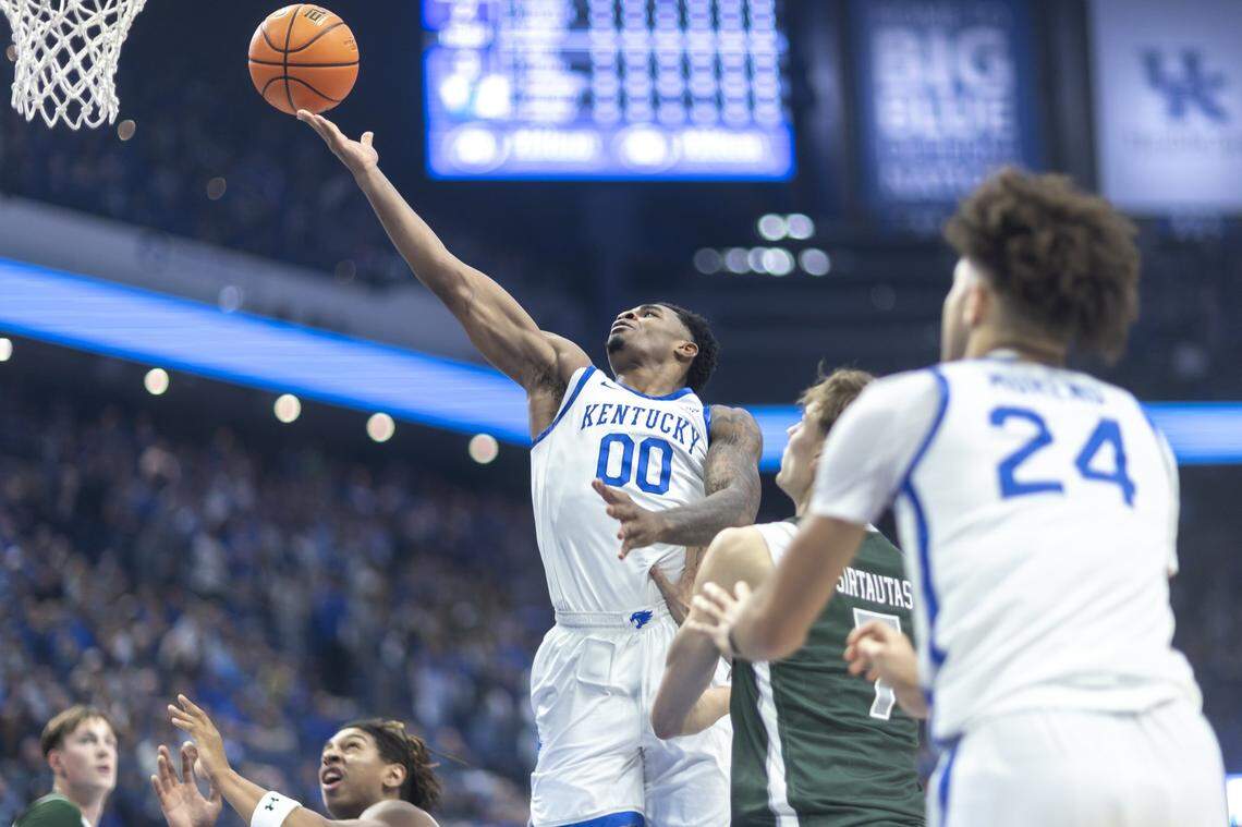 Kentucky guard Otega Oweh (00) shoots the ball past Loyola (Maryland) forward Jonas Sirtautas (7) during Friday’s game at Rupp Arena.