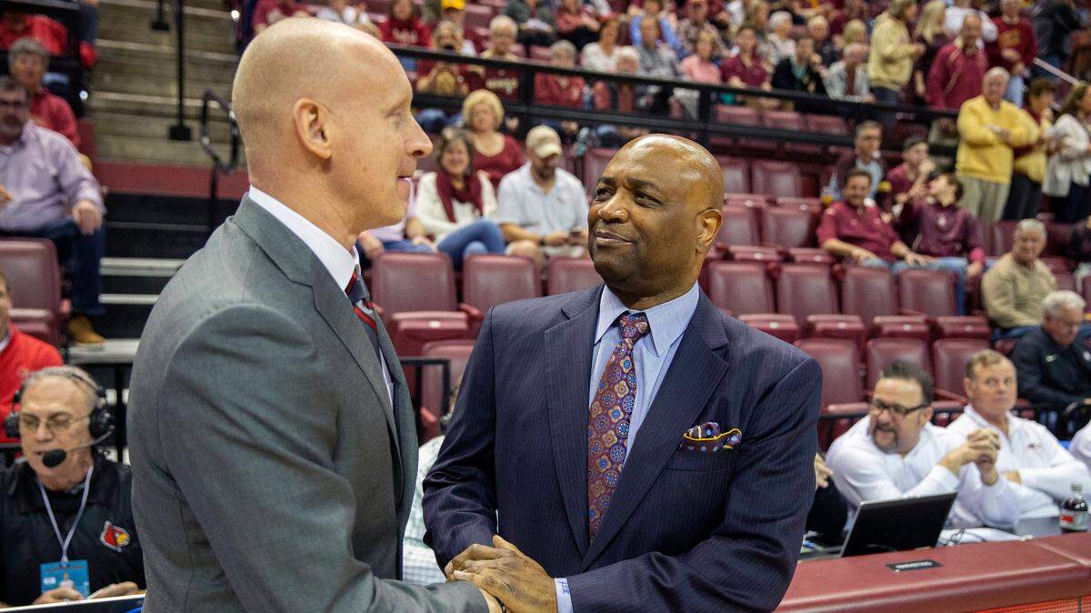 Florida State head coach Leonard Hamilton, right, and Louisville head coach Chris Mack, left, met before their game Monday night in Tallahassee, Fla. The Seminoles beat the Cardinals to take over first place in the ACC.
