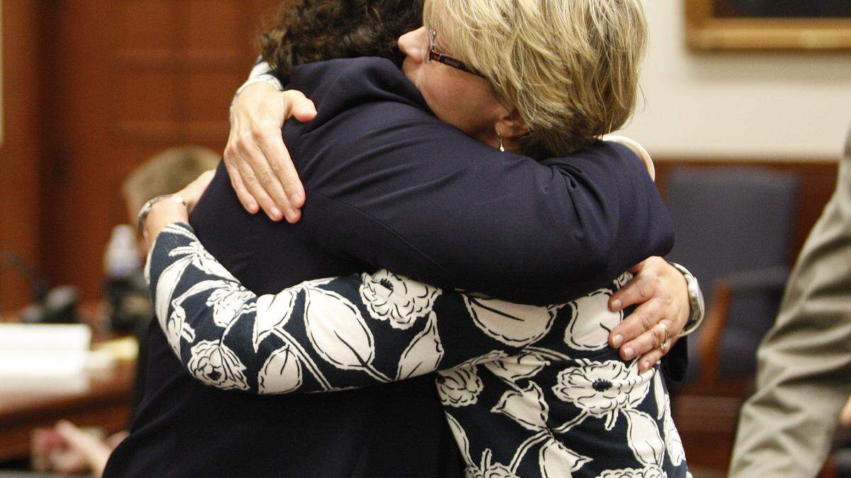 Assistant Commonwealth's Attorney Cindy Rieker, left, hugged Elizabeth Post after a jury found Marty Roe guilty Wednesday of first-degree murder in the salying of Elizabeth's sister, Dr. Martha Post.