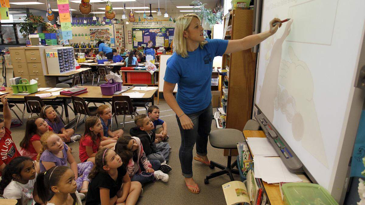 Teacher Anna Sirmon guided her students on Friday at Dixie Elementary Magnet School. Dixie has an ungraded  primary, which means all students in kindergarten through third grade are considered to be in the same grade.  