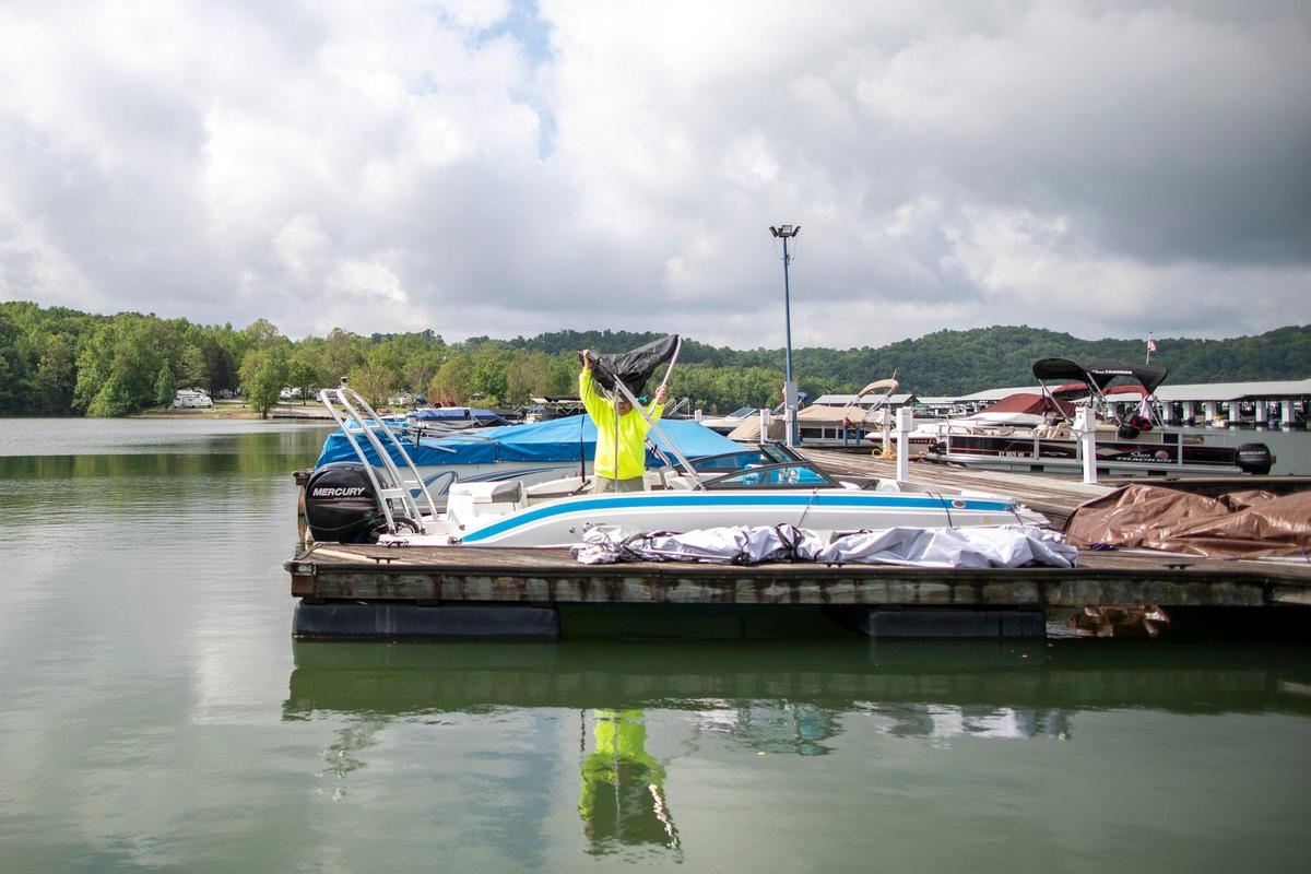 Oscar Drury, of Lexington, prepares his boat for the season at Conley Bottom Resort near Monticello, Ky., on Lake Cumberland on Tuesday, May 19, 2020.