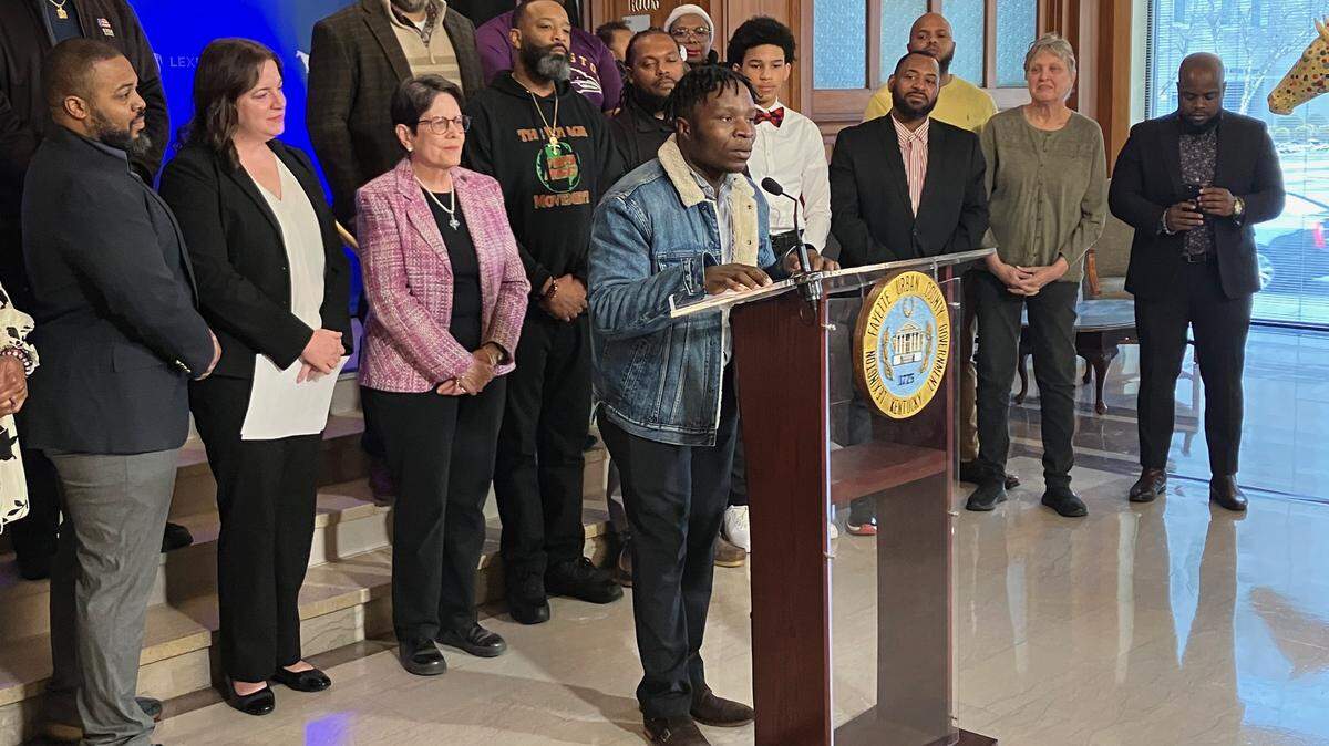 Elisha Mutyongwa of the Marafiki Center, an outreach center for African youth, speaks at a press conference on Tuesday, March 14, 2023.