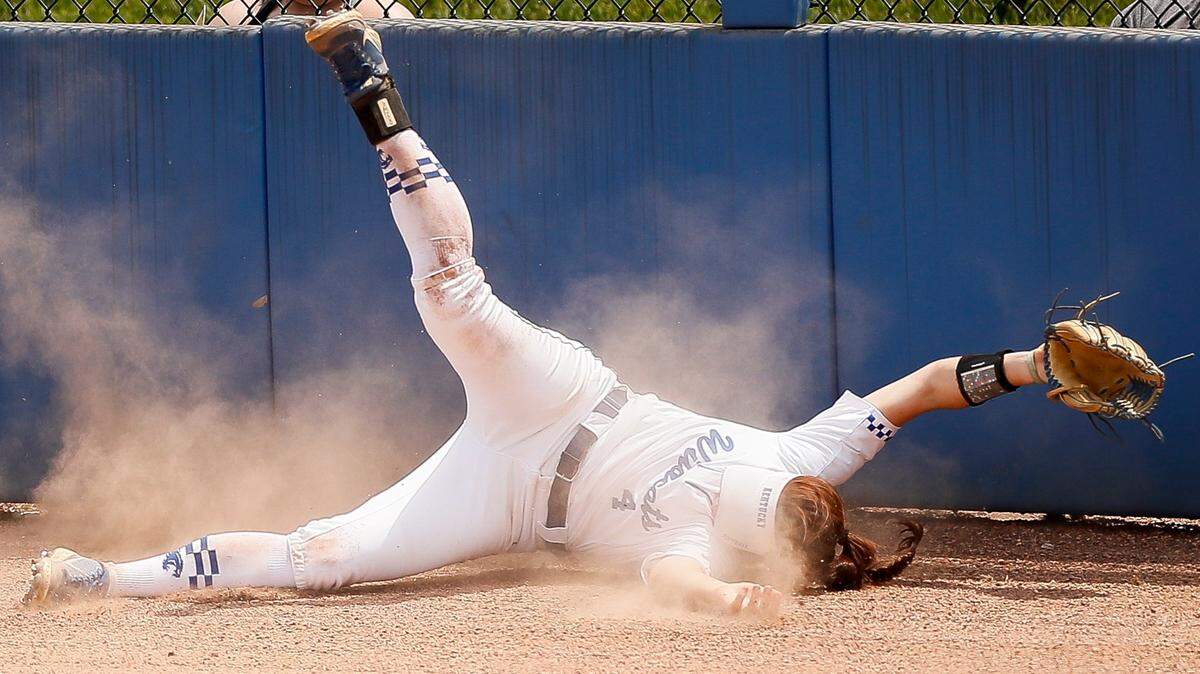 Kentucky outfielder Renee Abernathy couldn’t come up with the ball and collided with the wall during the NCAA Lexington Regional against Notre Dame at John Cropp Stadium on Saturday. The Irish won 12-3.