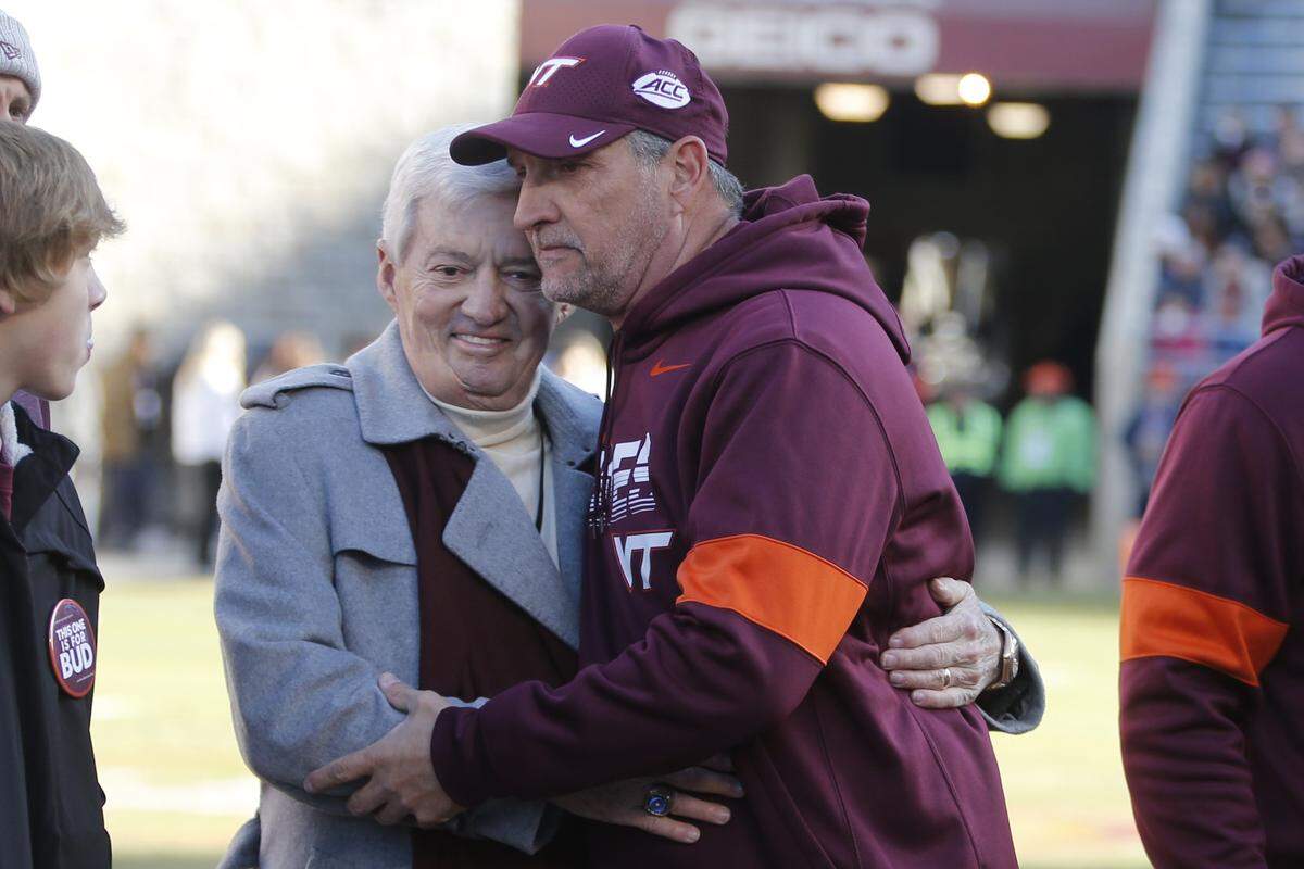 Retiring Virginia Tech defensive coordinator, Bud Foster, right, got a hug from his old boss, former Hokies coach Frank Beamer, prior to Tech’s 36-17 win over No. 22 Wake Forest on Nov. 9.