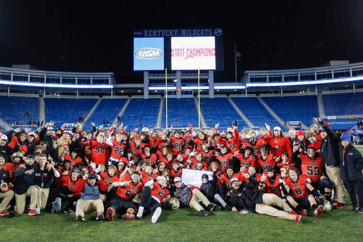 Bullitt East players posed with their trophy after winning the school’s first state championship in football.